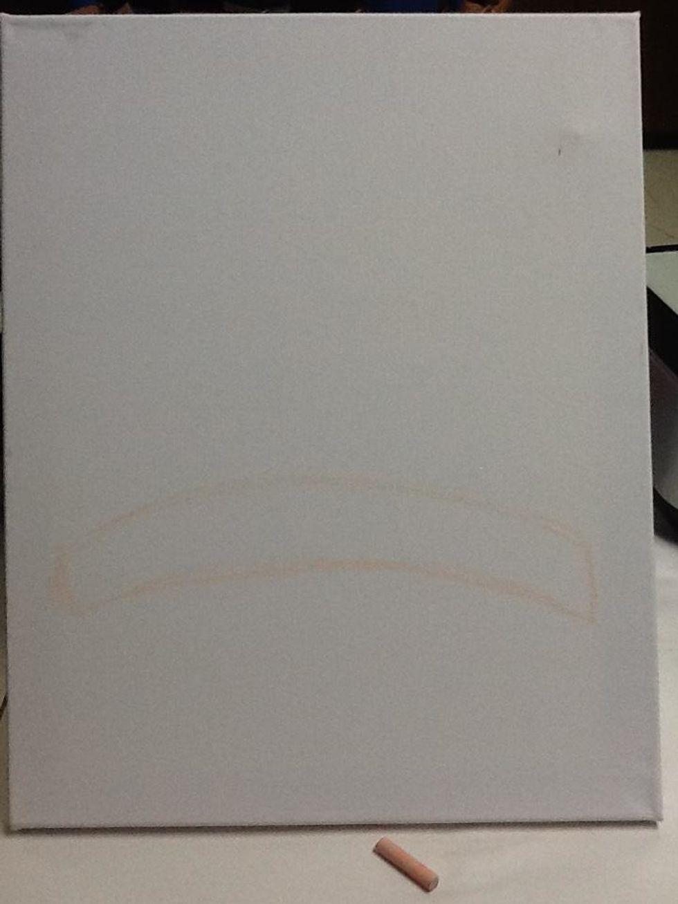 First, use chalk to sketch Santa. Begin at the bottom third by drawing two curved lines about 2 inches a part.