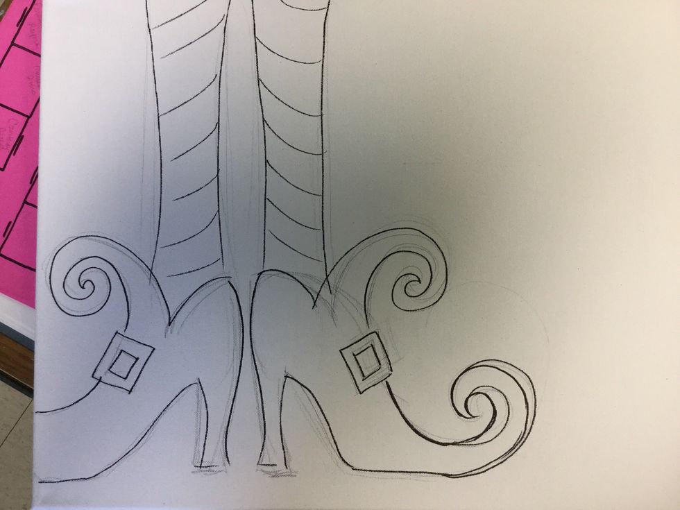 First use your chalk or pencil to sketch the witch's feet and legs. Don't be concerned with perfection. It is a witch. I used a sharpie so you can see it easily.