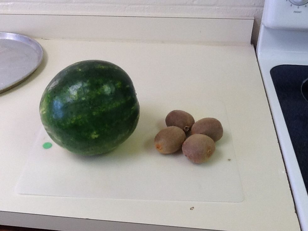 First wash and lay out the fruit and find a spot to place a cutting board.