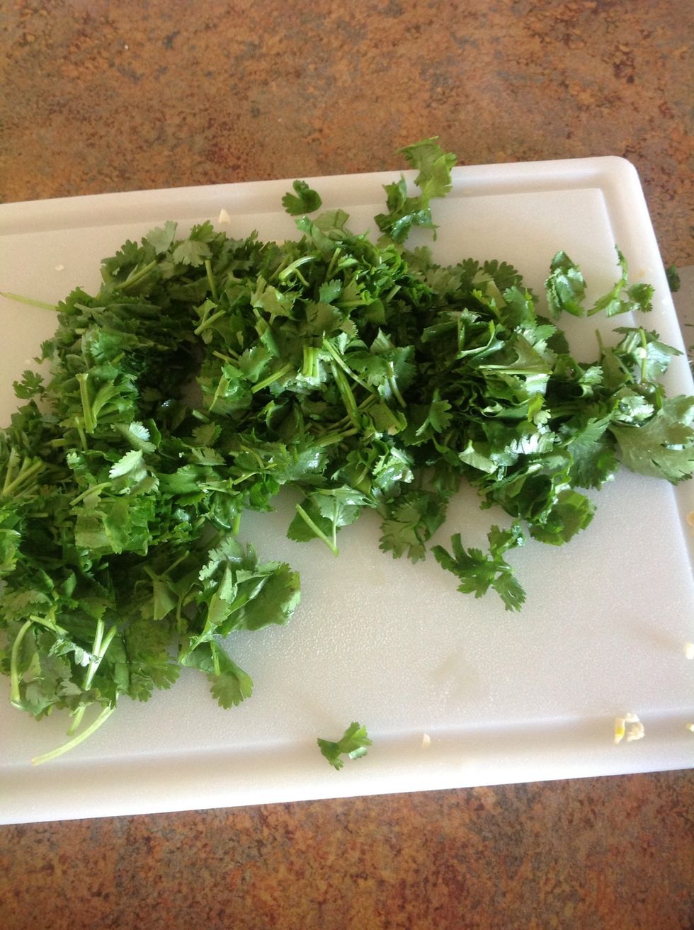 First wash the cilantro then carefully using the knife chop it into small pieces.