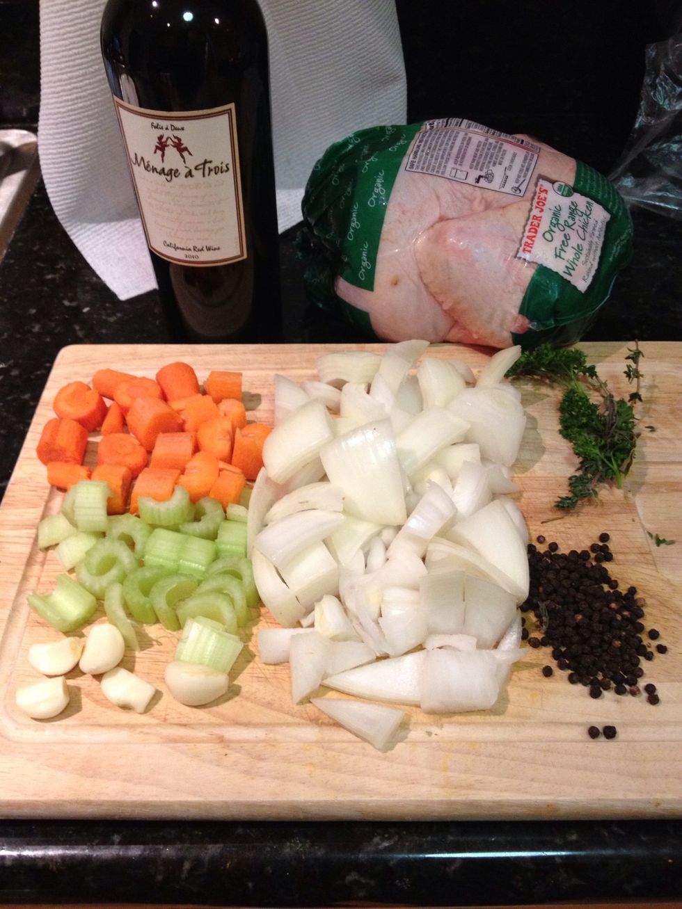 First we are going to make the marinade. Dice the celery, onion, and carrot. You'll also need one bouquet garni (next step), black peppercorns and of course red wine.