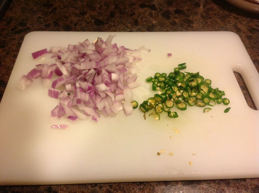 First, we need a nice Fresh salsa to put on top. Chop your onions and chiles. I'm kind of crazy with the spices, so you might prefer jalape\u00f1os over the Thai chiles I have here.