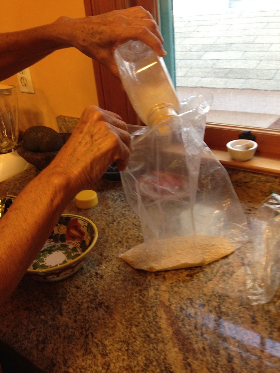 First we're going to prepare the coating for the fish. Put panko (Japanese style breadcrumbs) in a bag.
