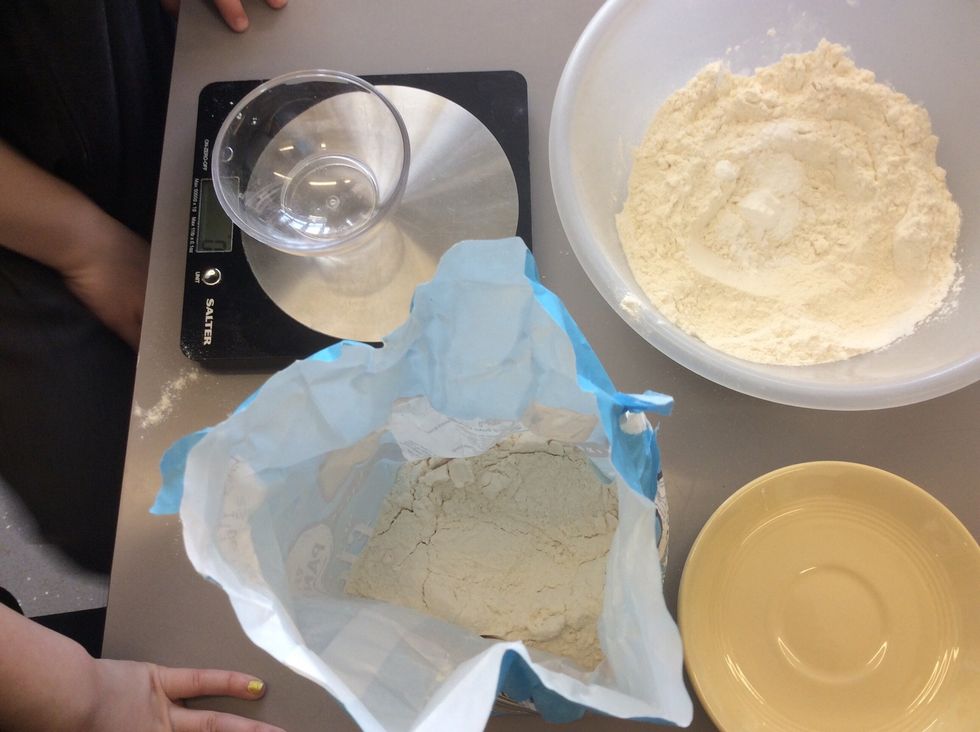 First weigh your ingredients. Then put the flour, sugar and butter into a large bowl.