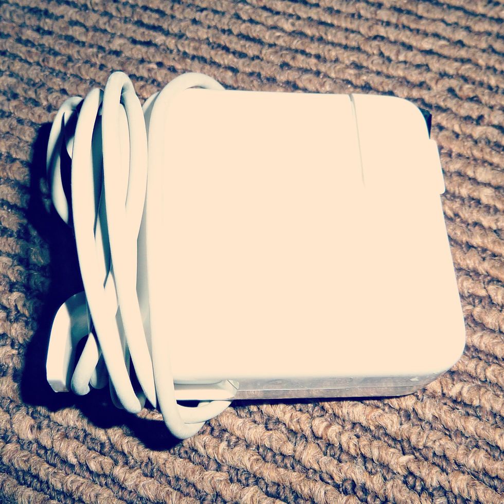 First, wind the cable attached to your charger around the winding ears, just as you normally would.