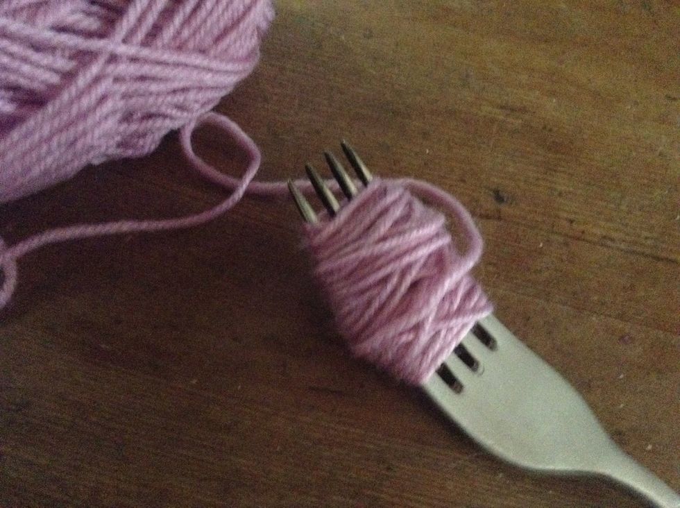 First wrap wool around the fork like in the picture