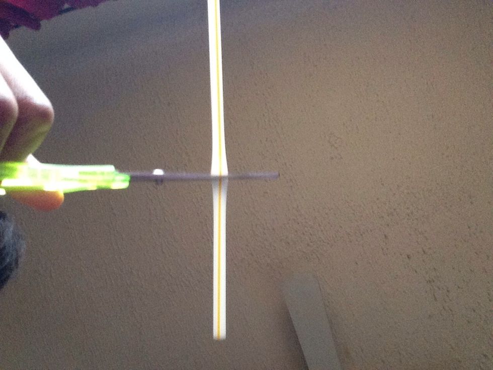 First you are going to cut your straw in half.