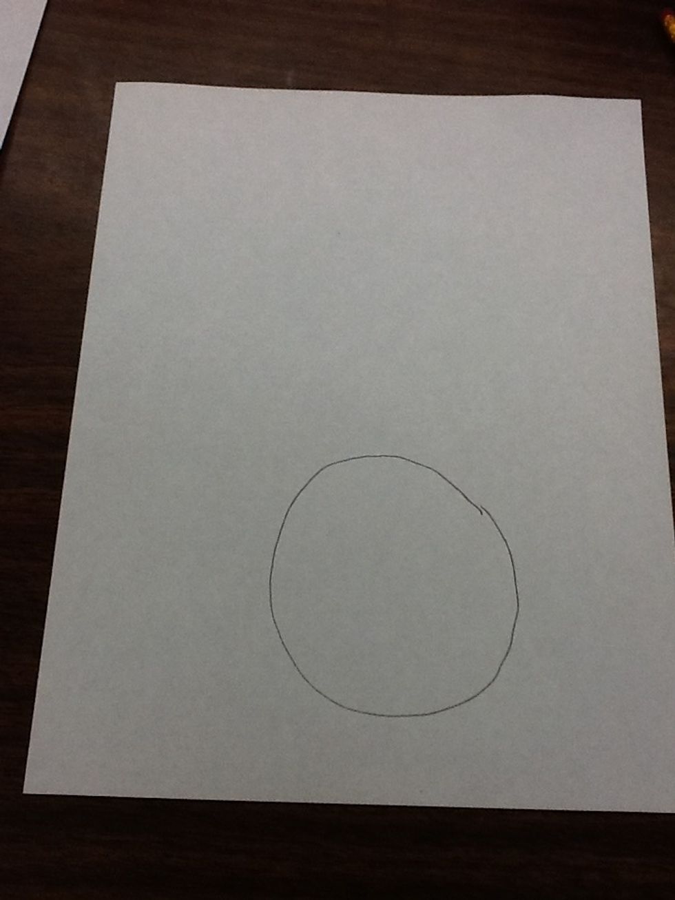 First you draw a big circle at the bottom of the sheet