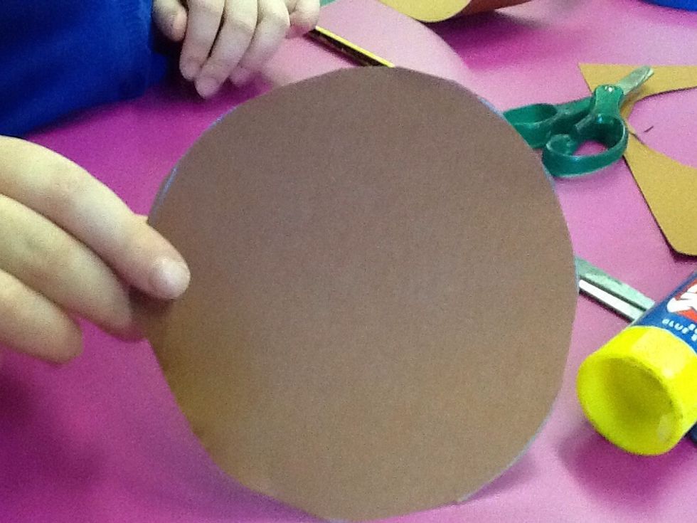 First,you draw a circle and cut it out.