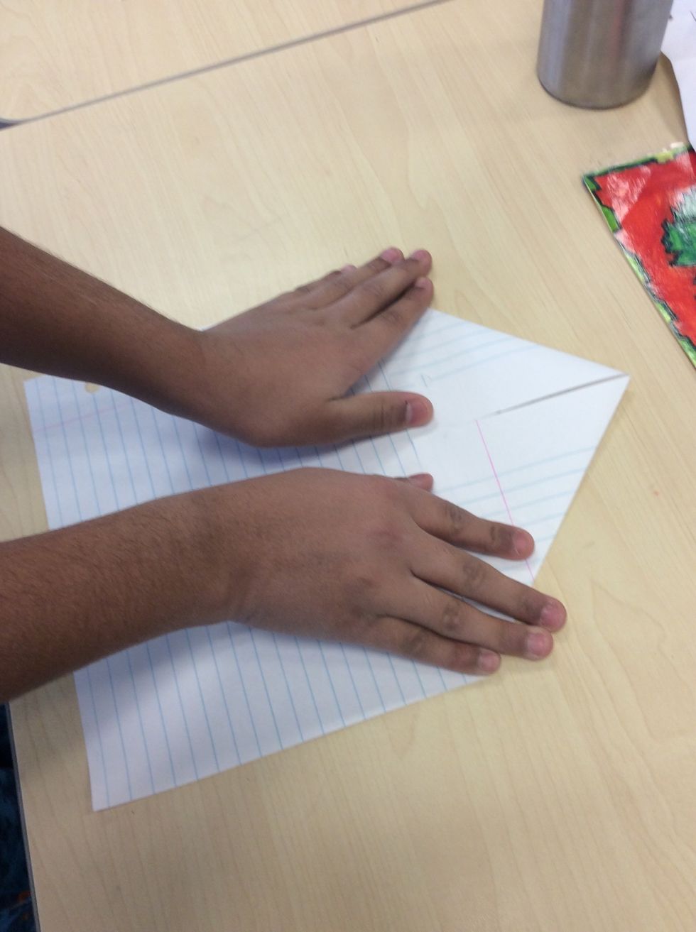 First you fold the 2 top corners like this.