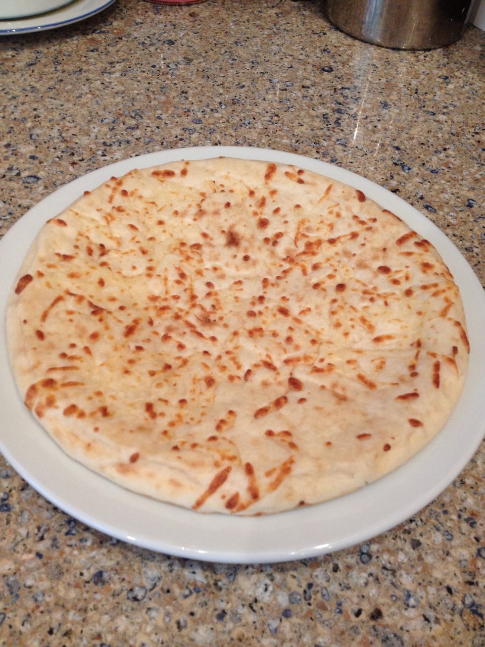 First you get your mini Boboli crust on a plate.