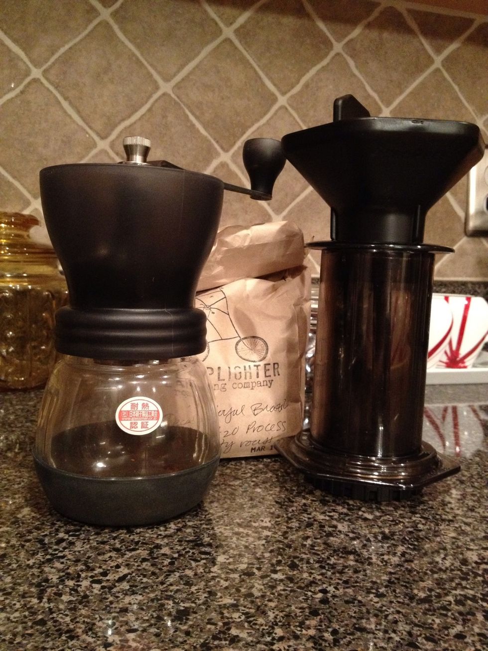 First, you'll have to have a conical burr grinder to create uniform grinds (manual or electric.) Next, you'll need fresh beans to grind. Finally, you'll need an AeroPress (of course.)