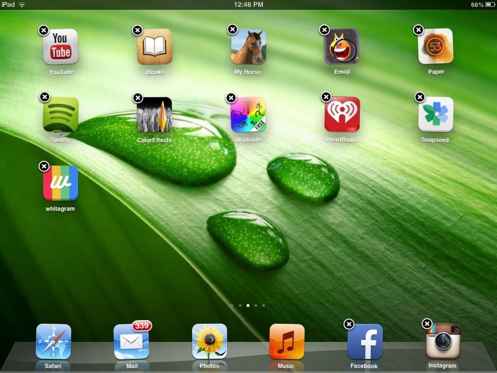 First, you'll need to press down on any app for about 2 seconds. Once done, there will be an "x" in the corner of each app.
