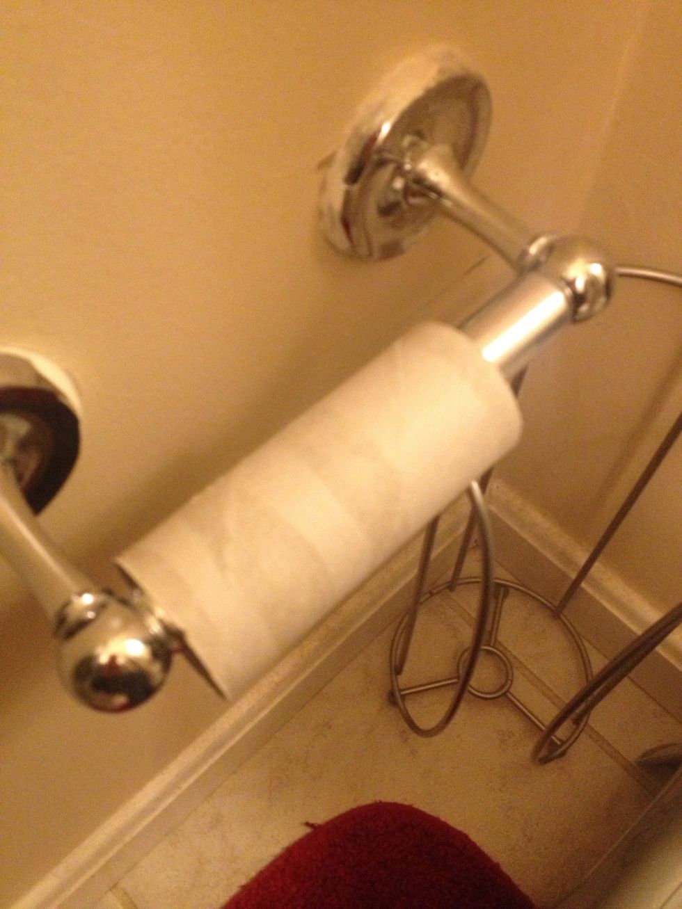First you must remove the old toilet paper roll