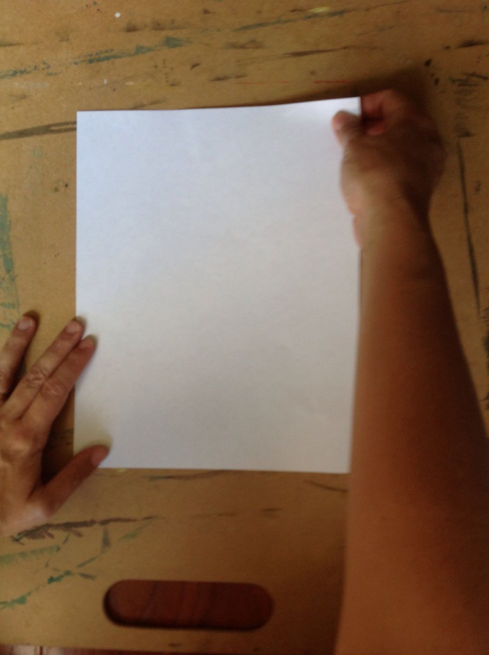 First you need a square of paper. If you don't have a square, here is an easy way to make one. Take the top right corner of your paper (left if you are left handed).