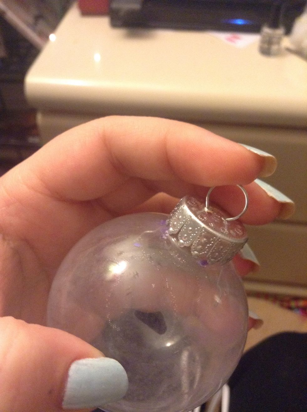 First you need to pull the top off. You just gently pull the ring.