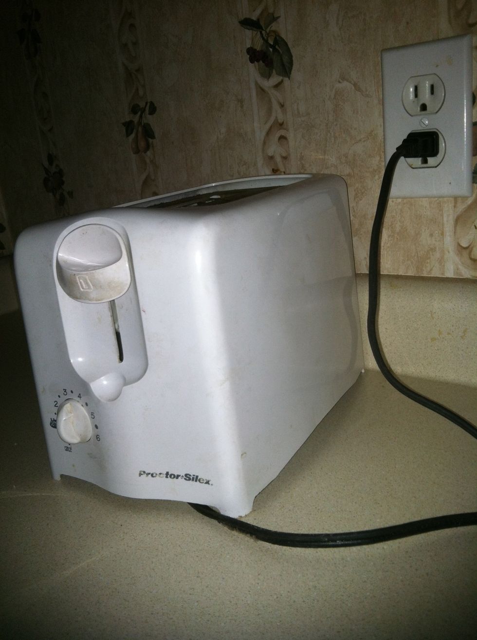 First you plug in the toaster