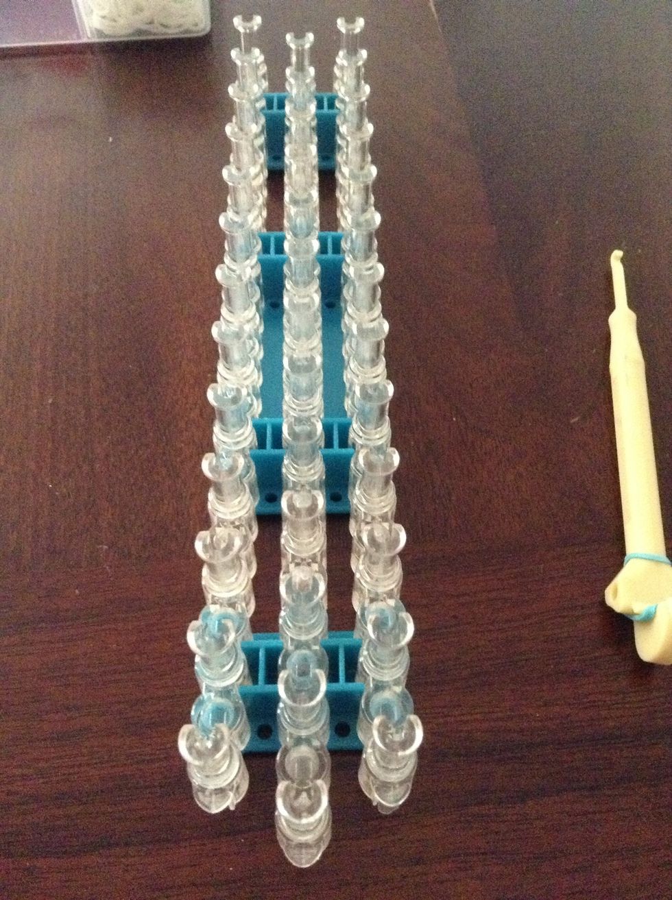 First you put your loom like this. And make sure the arrow is pointing away from you.