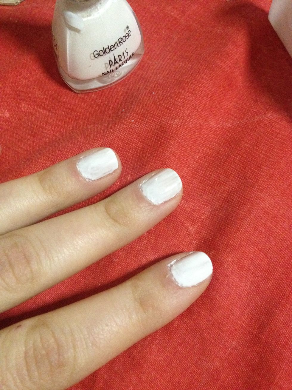 First you're going to paint your base color, i decided to go with white one you can apply one layer