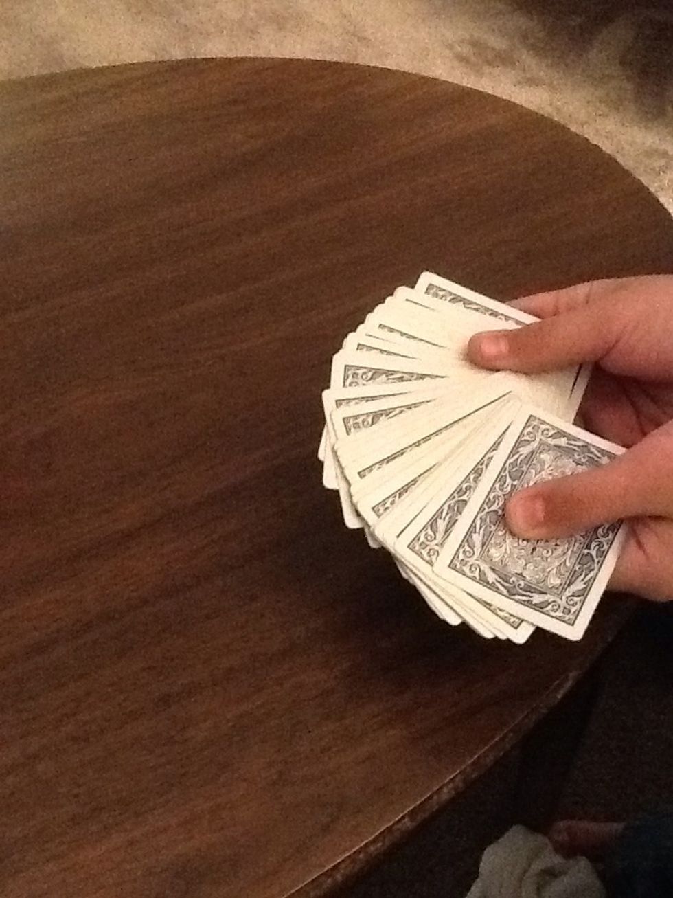 First you show the person all the cards and tell them to pick one