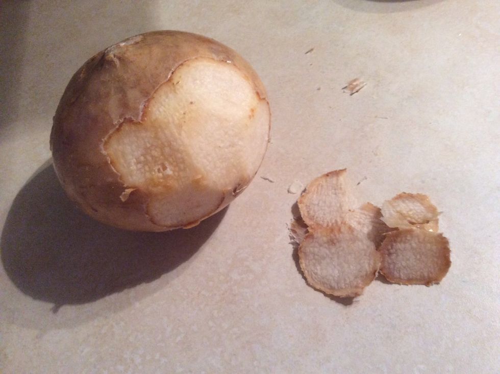 First, you skin the jicama because it is like a potato,it has skin you have to cut off.