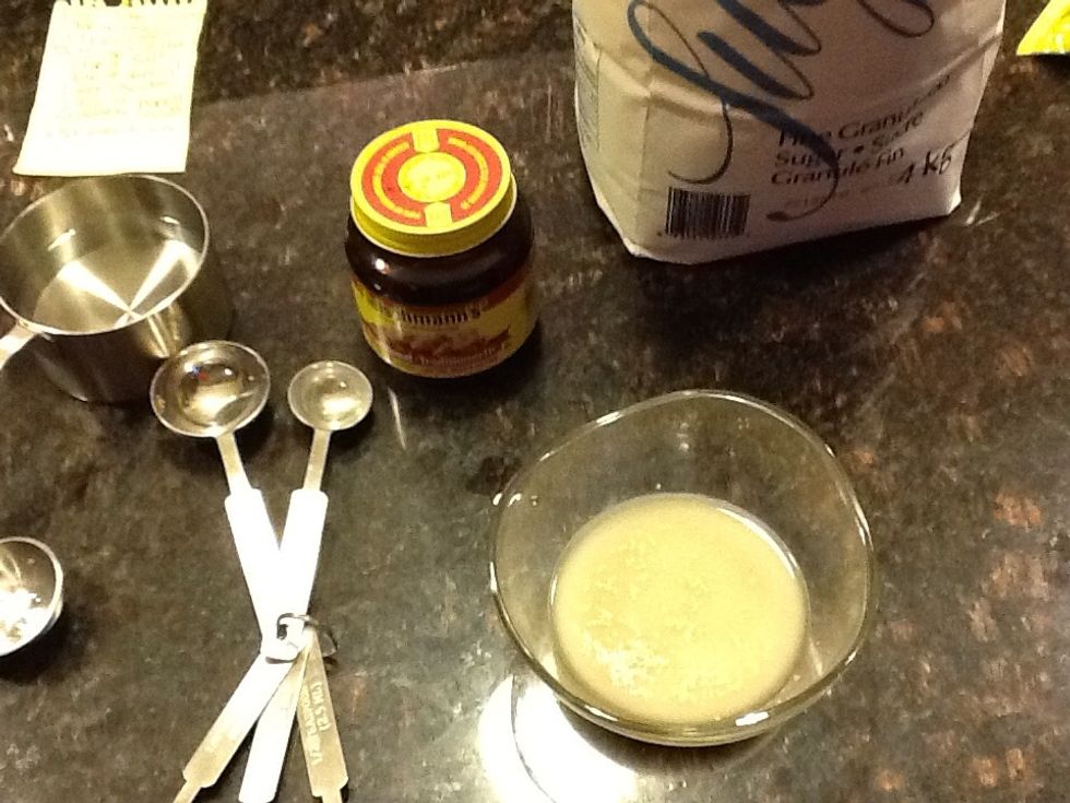 First you take 1 small bowl and put 3 TBSP of water in it also put yeast and sugar. Use your finger to mix it, leave it in a warm place for 10 minutes or just until it starts to bubble