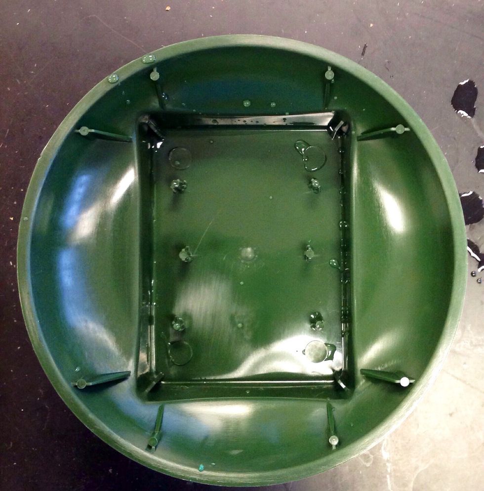 First you take a standard dish. It is used to hold a 1/3 brick of oasis. The oasis is also held in by six prongs which are located inside the standard dish. It also influences the arrangements shape.