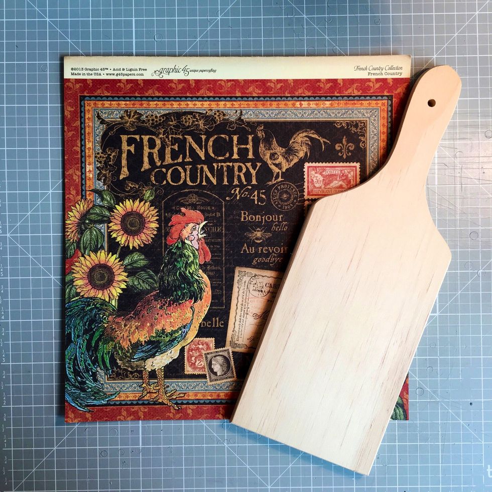 First you will need an unfinished or old cutting board. Adjust paper size according to your cutting board size. Then choose a piece of Graphic 45 Paper. I chose a piece from French Country.
