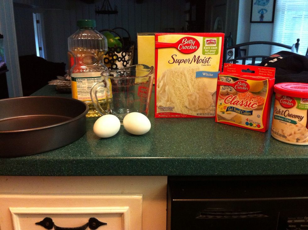 First, you will need cake mix, ingredients for the cake mix (eggs, oil, water) confetti frosting, food coloring, a round pan and a measuring cup. You can do this with a friend or by yourself!