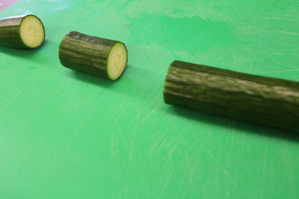 First you will want to take your knife and cut the cucumber. The section of the cucumber you will be using should be around 2 inches long.