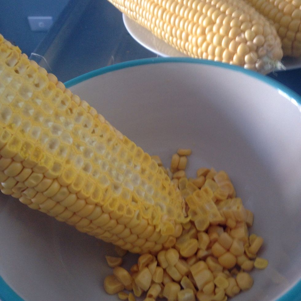Firstly, cut corns into small pieces.