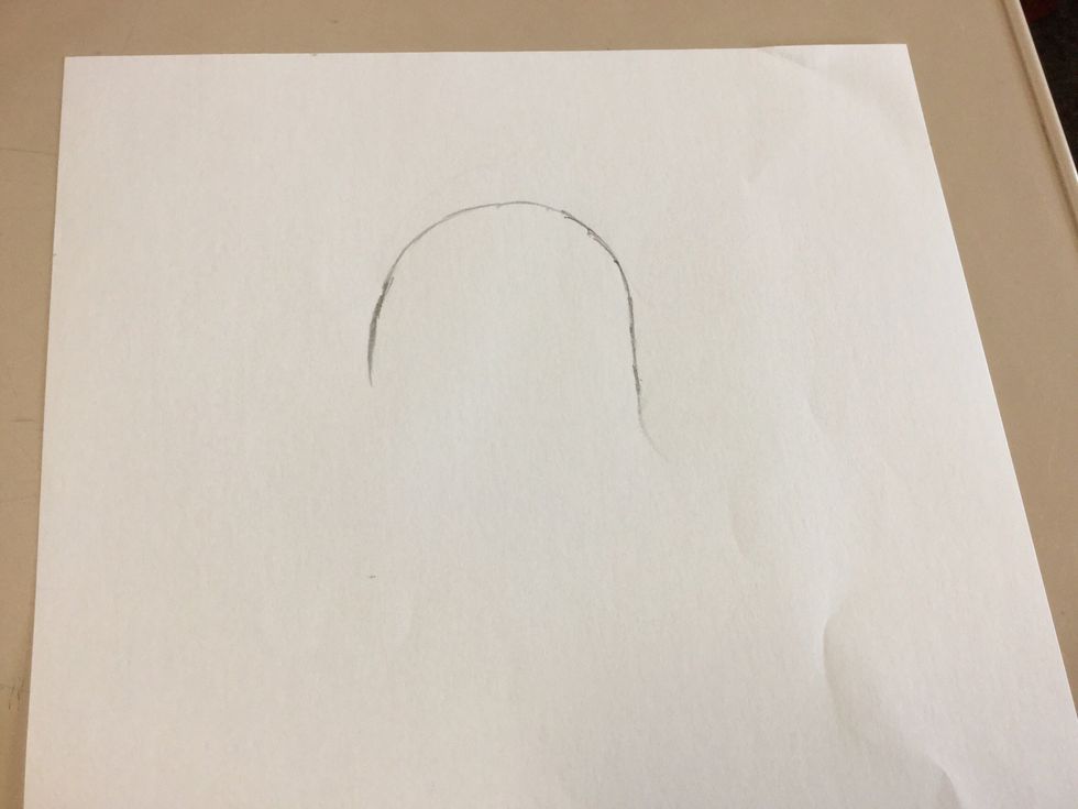 Firstly, draw half a medium sized oval, approximately 4cm away from the top.