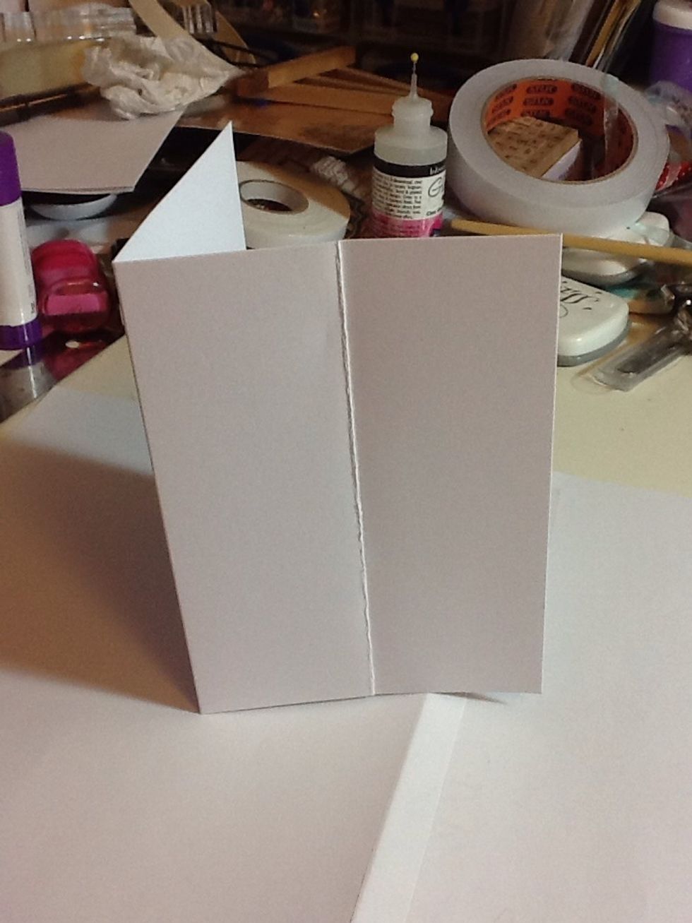 Firstly fold the front of your base card in half, don't worry it won't be visible by the time we're done