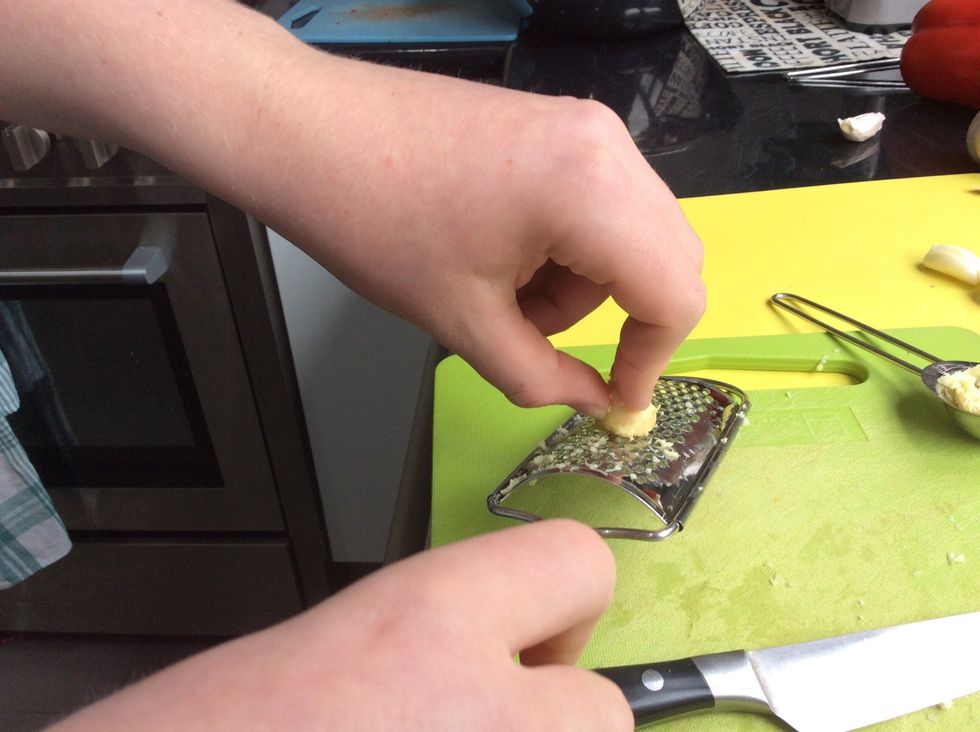 Firstly, get a piece of ginger and peel it. Grate the ginger until you have 1 tablespoon of ginger