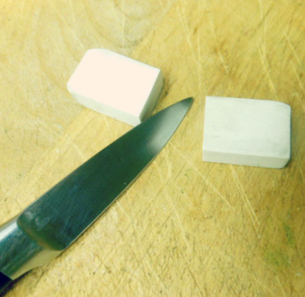 Firstly you want to cut your eraser in half this will make you two kitty erasers (double cuteness!!! <3 <3 <3)