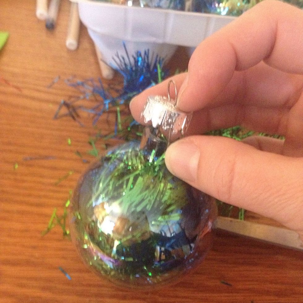 Fit the top back onto the ornament.