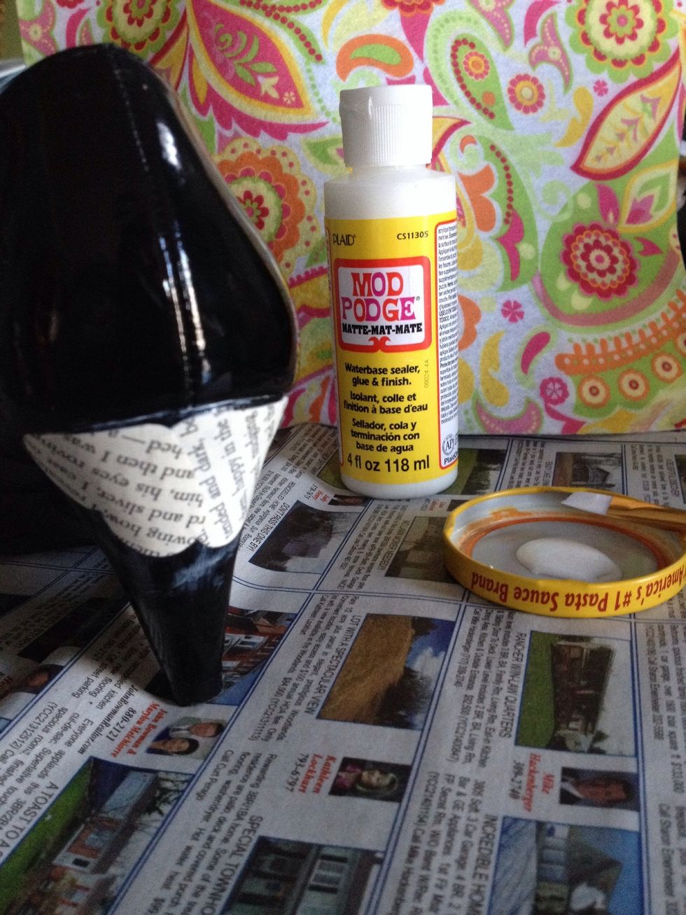 Fit your clippings on however you wish and continue the same mod podge, clipping, mod podge formula. Make sure to try for an even coating.