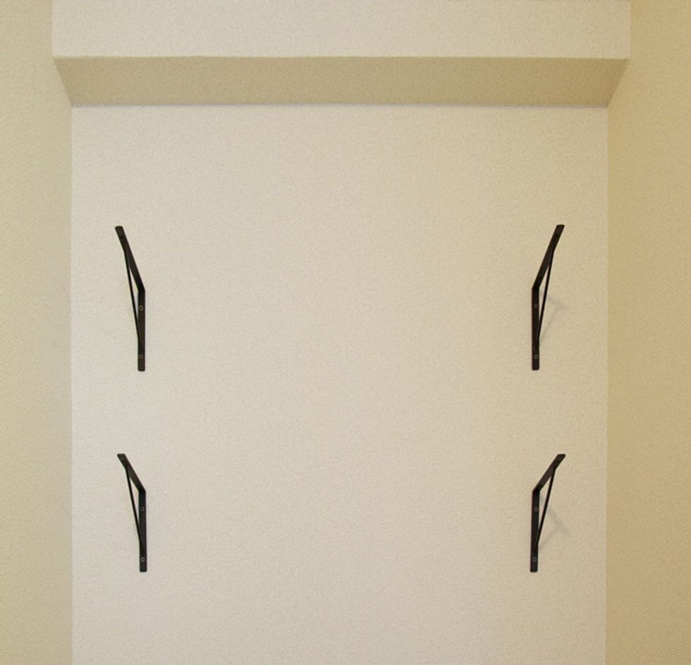 Fix a bracket to the wall.