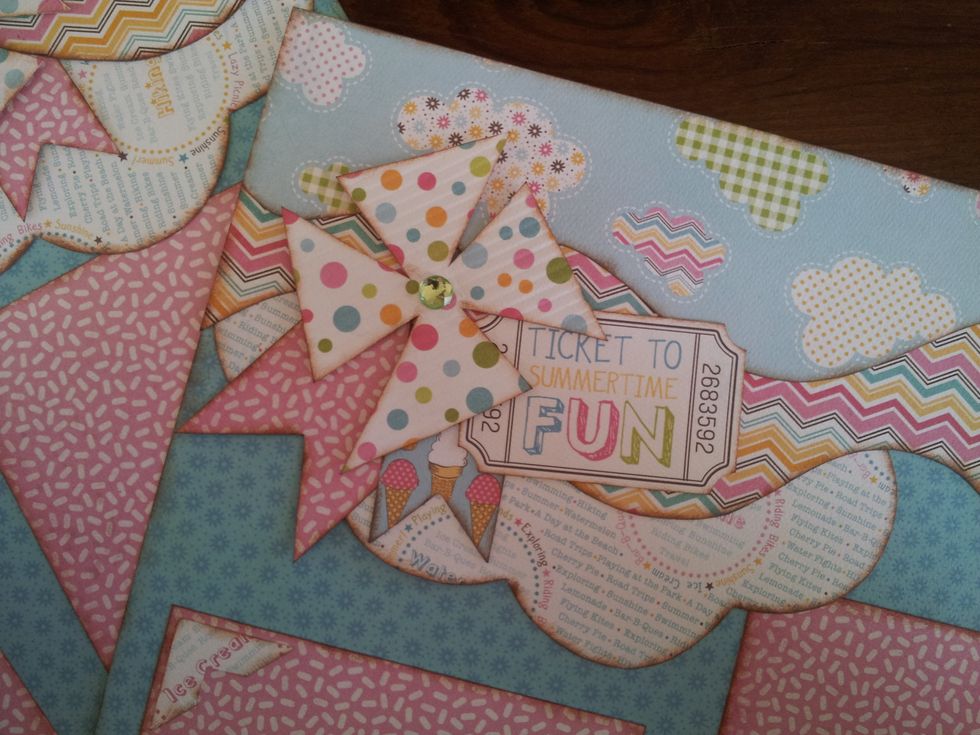 Flat pinwheel on a scrapbook layout.
