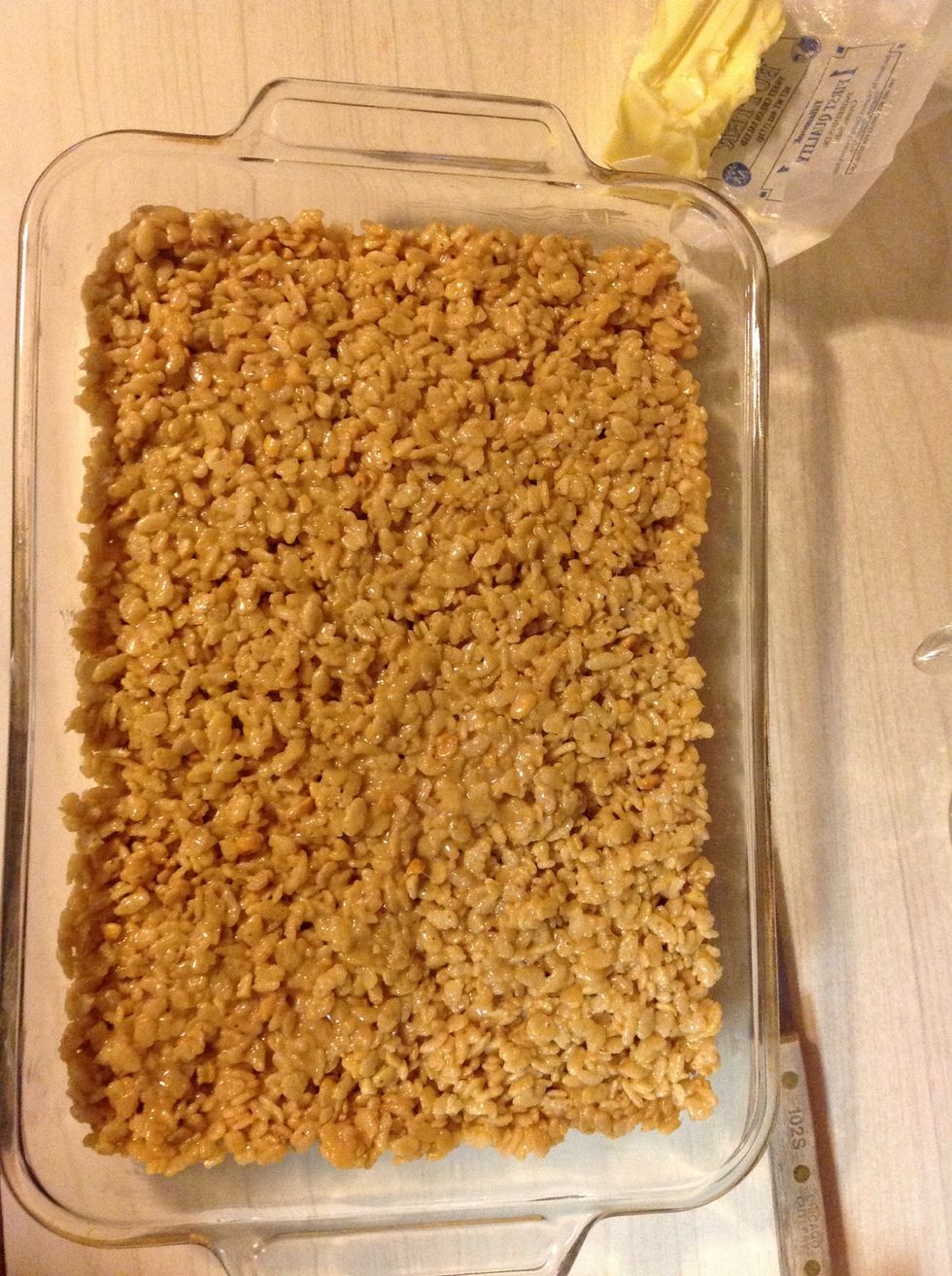 Flatten and spread the Krispies until uniform (more or less).