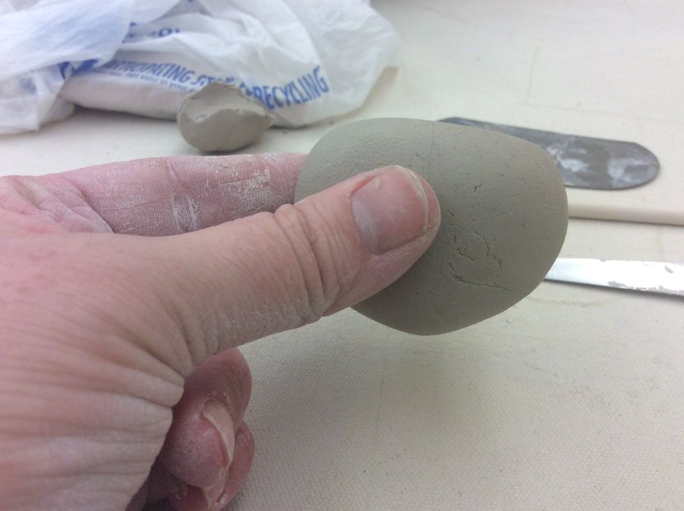 Flatten ball on one side.