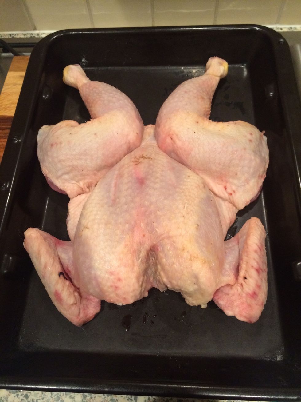 Flatten chicken into pan skin side up
