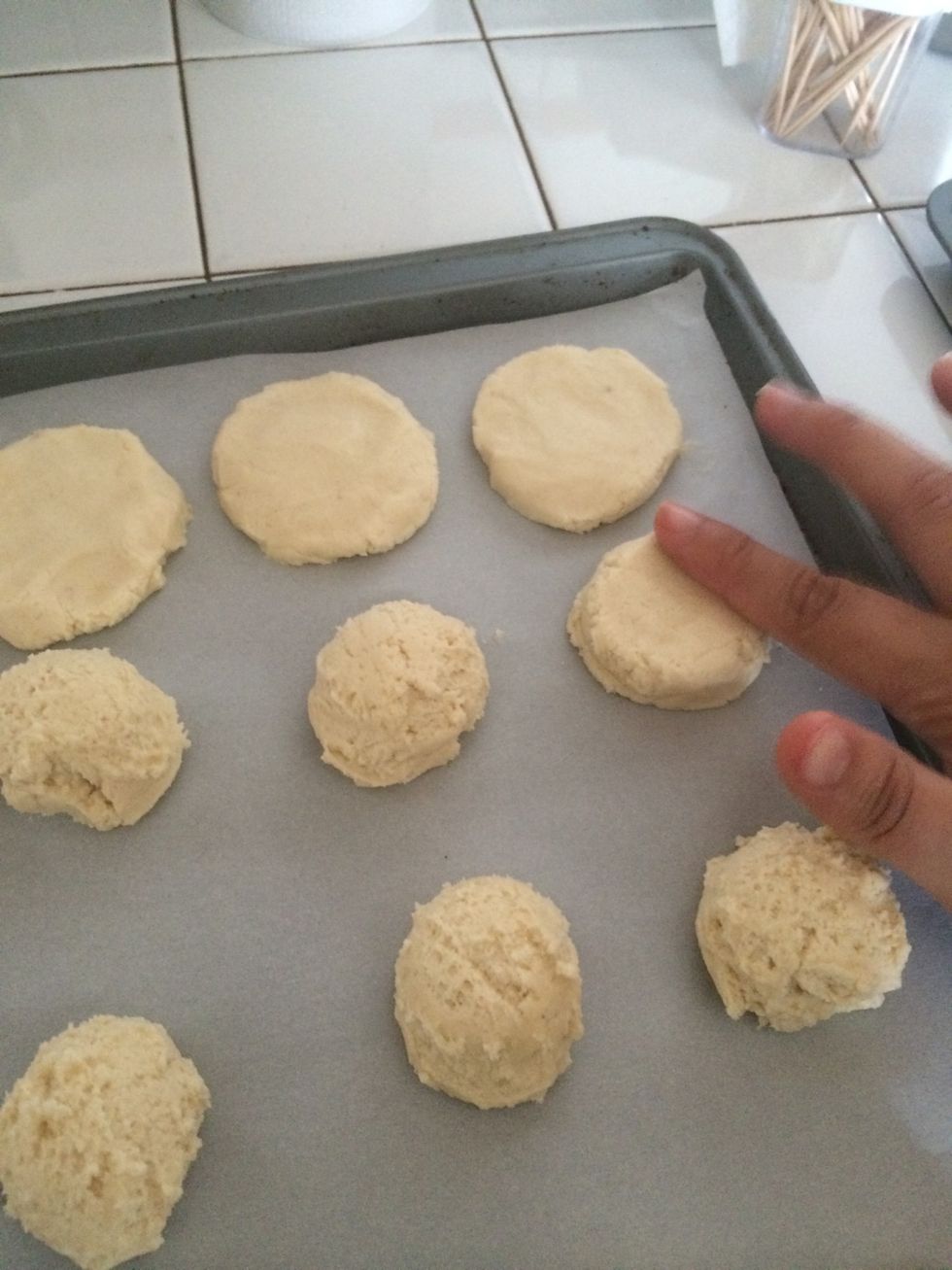 Flatten into a circle - the cookies don't spread much, so can be spaced about an inch apart