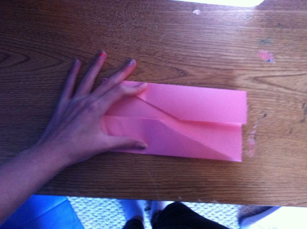 Flatten it again, but this time use one hand to keep it flat.