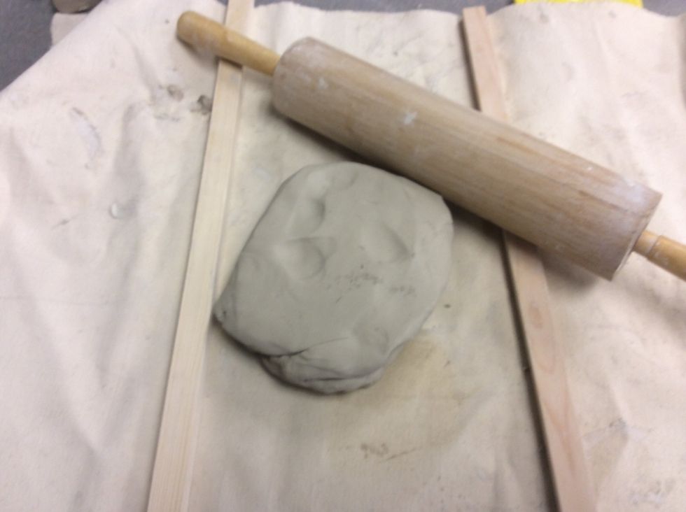 Flatten out a piece of clay