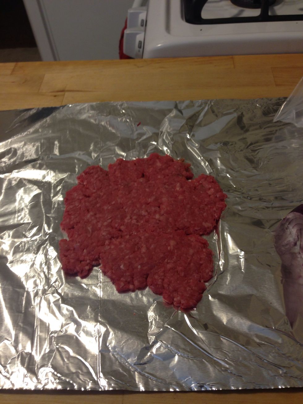 Flatten the beef out. It should be a very thin layer of beef.