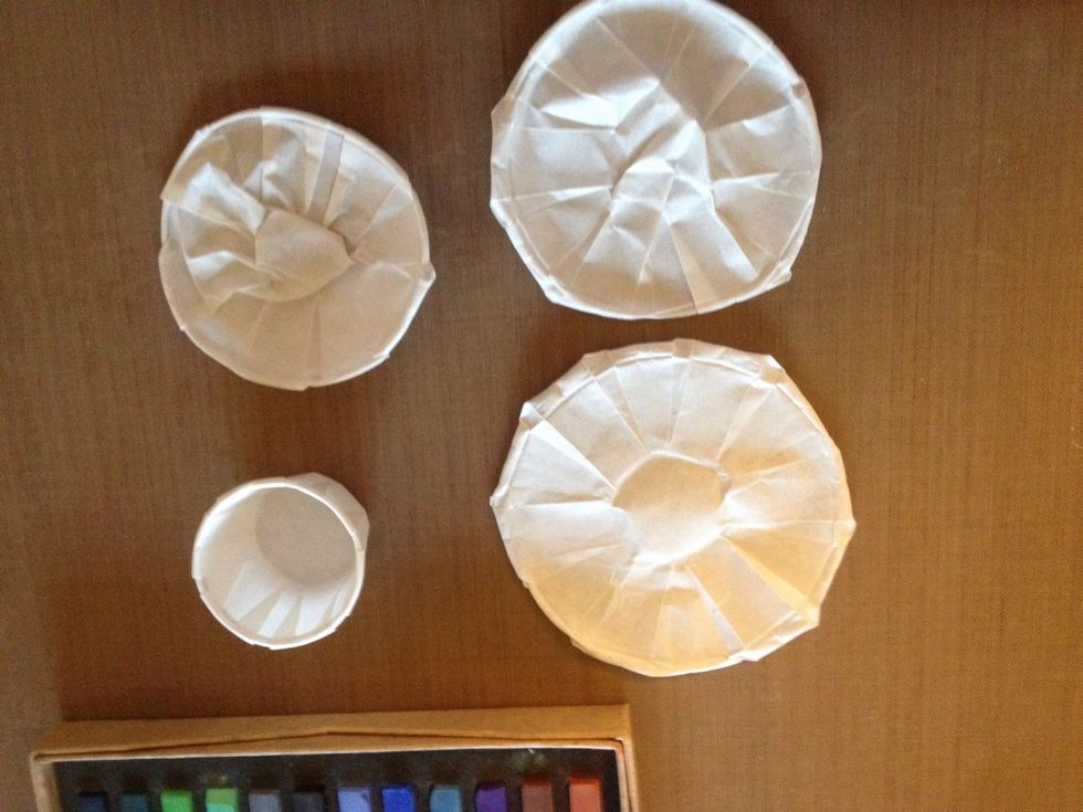 Flatten the cups. You can decide if you want a big layered flower. Totally up to you how many cups you want to use per flower. You can stretch the cups all the way. I did mine in small, med, lrg.