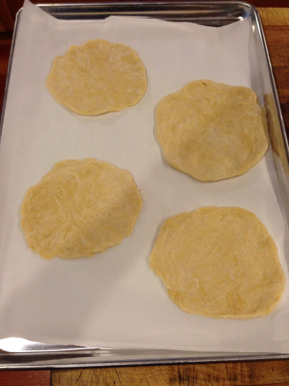 Flatten with your palm, or a rolling pin, and place on parchment lined baking sheet!