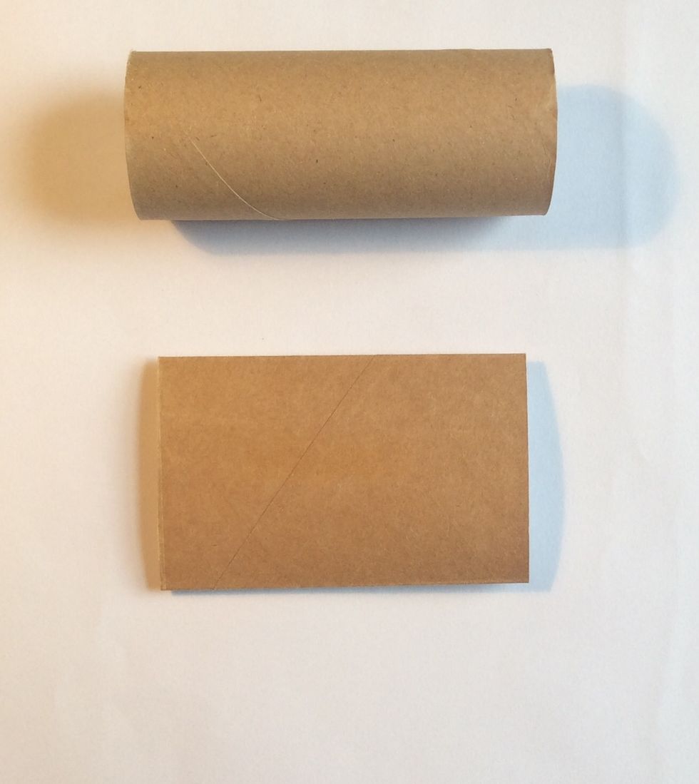 Flatten your cardboard tubes using a any apparatus that applies enough pressure. I used a big shot. The album example has five tubes to create five pages.