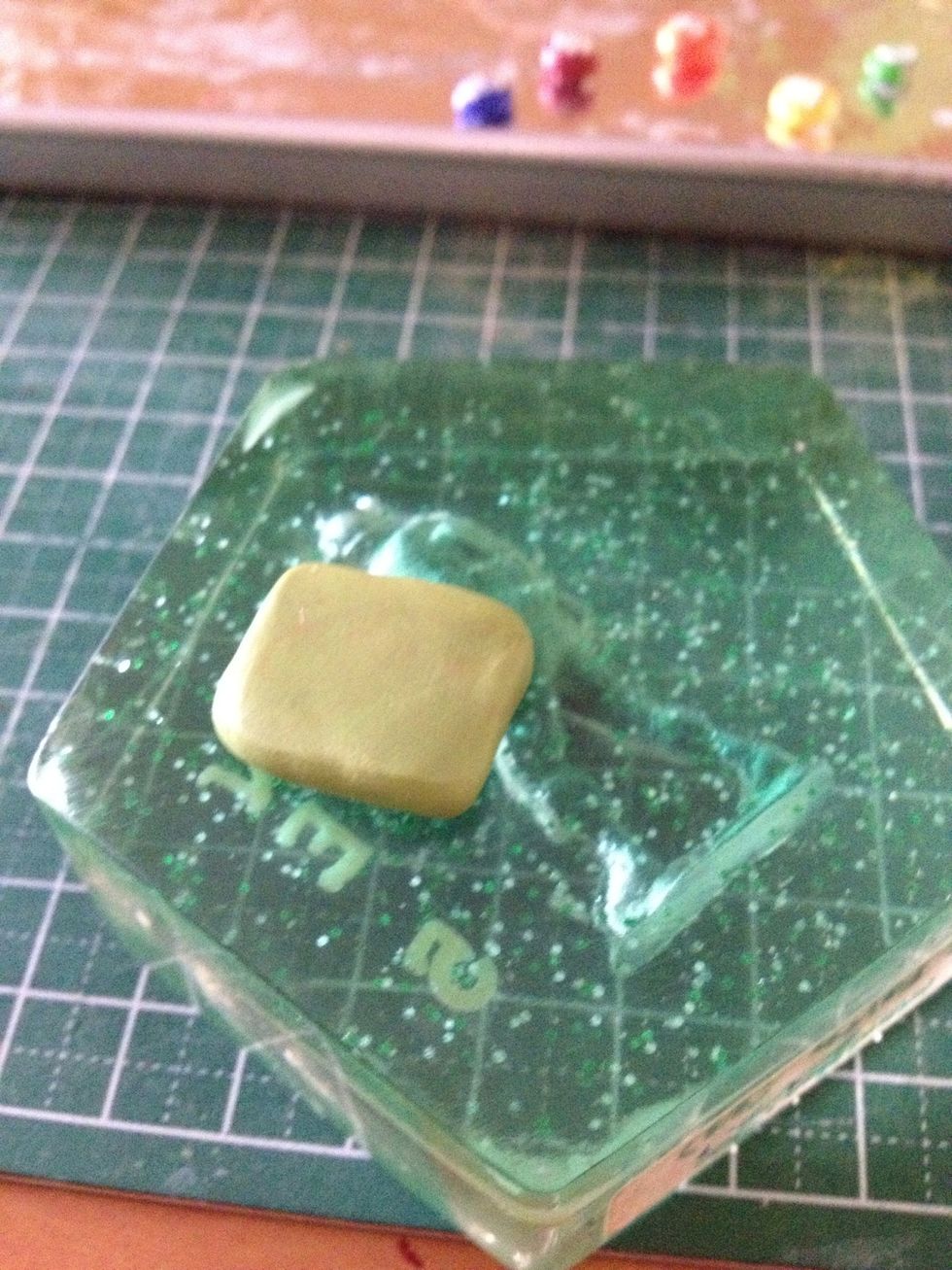 Flatten your olive-coloured clay into a thick slab. This colour can be achieved by mixing brown with leaf green clay.